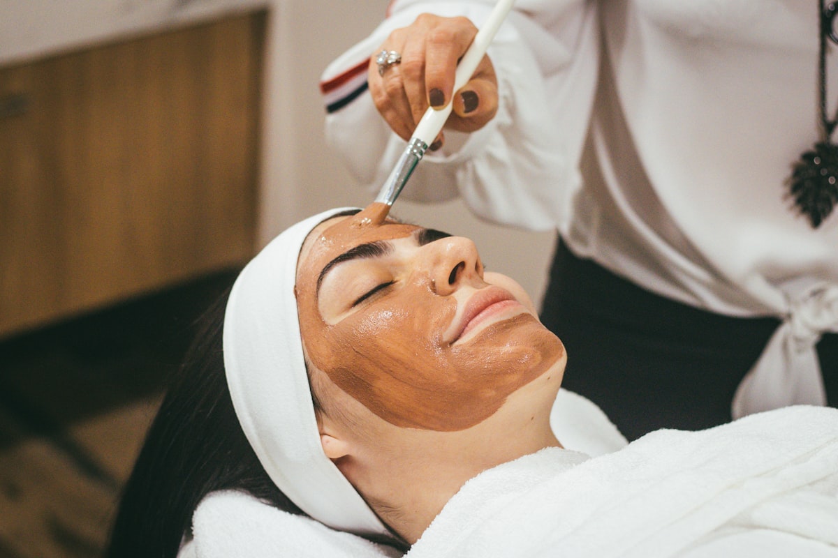 Brightening mask being applied during a vajacial treatment in San Jose